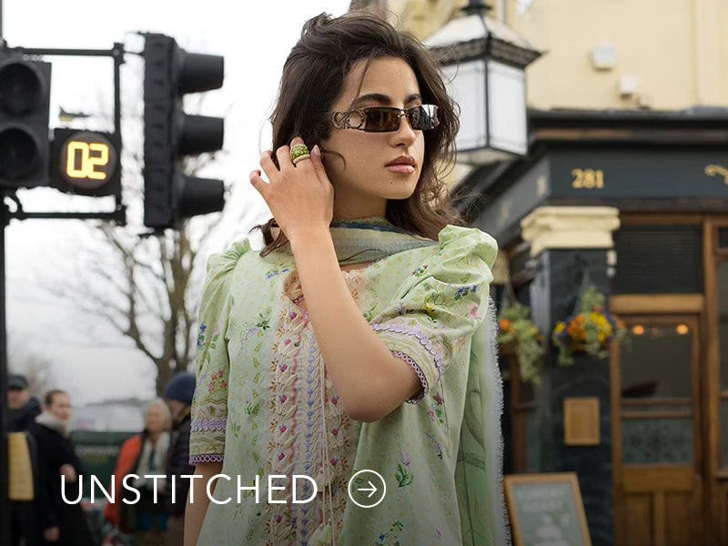 A banner on Nainpreet featuring embroidered unstitched ensembles with vibrant detailing and soft contrast.