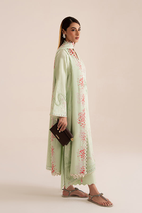 Side profile of Nore: mint green jacquard lawn set with coral embroidery, scalloped edges, and printed chiffon dupatta.