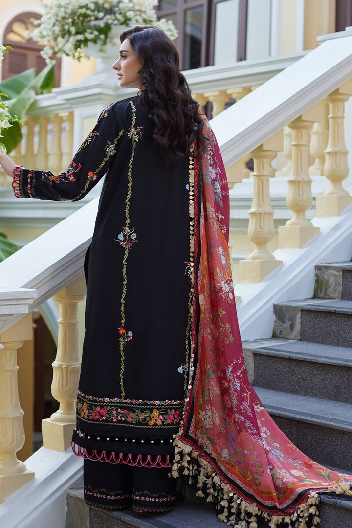 Model in Nainpreet Enchanted Noir: a black lawn shirt, richly embroidered with vibrant florals, seen from back. Its printed silk dupatta makes it ideal for Indian festive wear.