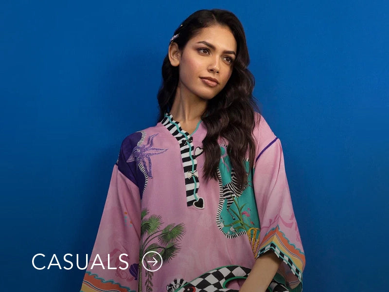 Model in a light blue casual kurta with floral and geometric prints; “Casuals” text below on Nainpreet’s banner..