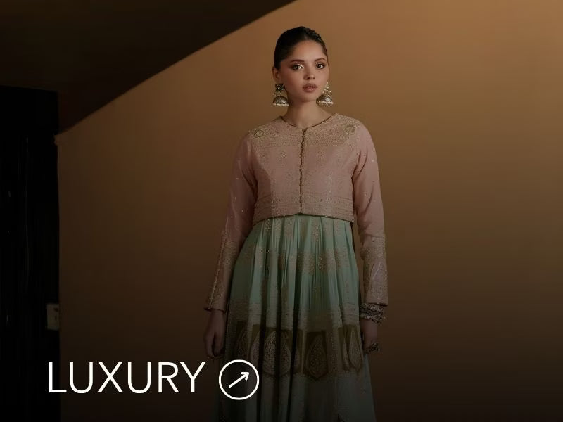 Nainpreet banner with pastel green outfit, a model in embroidered green ensemble, pink embroidery, floral earrings, and “Luxury” label.