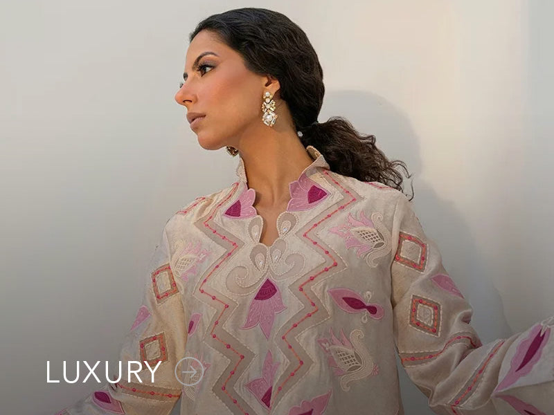 Nainpreet banner with pastel green outfit, a model in embroidered green ensemble, pink embroidery, floral earrings, and “Luxury” label.