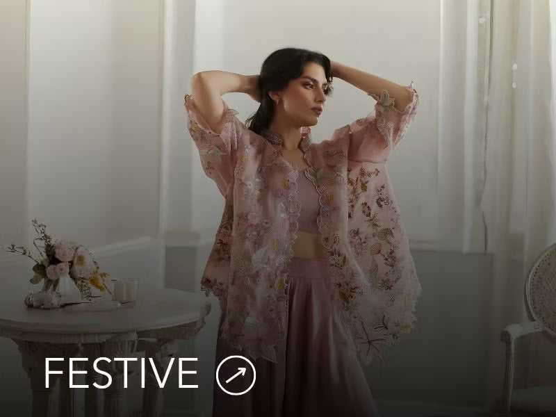 A banner for the festive collection on Nainpreet, featuring embroidered velvet and celebratory accents.