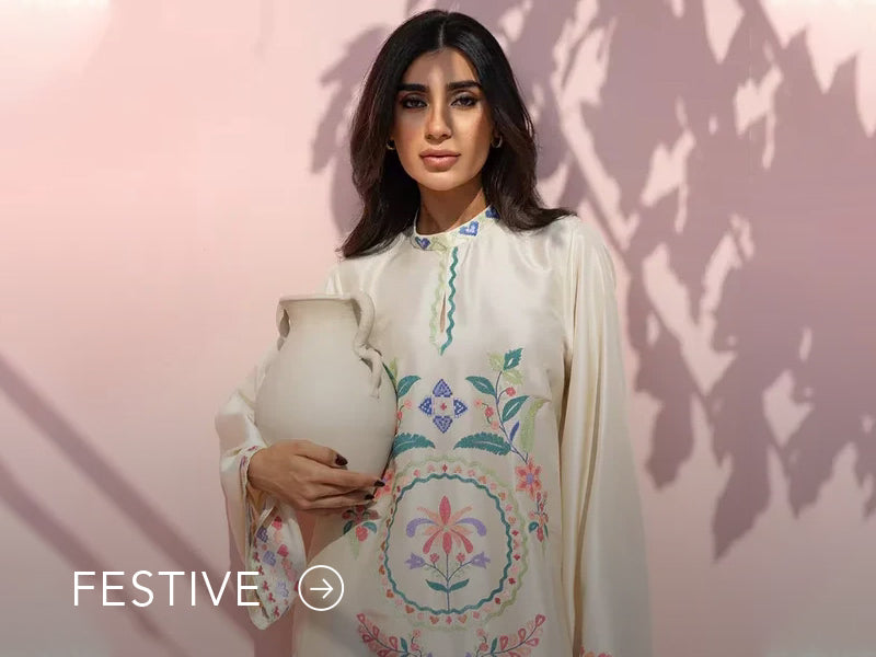 A banner for the festive collection on Nainpreet, featuring embroidered velvet and celebratory accents.