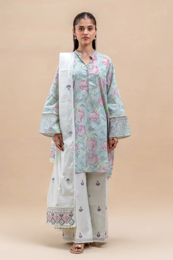 Back view of Pastel Blush—light blue floral kurta with printed sleeves, white palazzos with scattered motifs, and a matching voil dupatta held in hand.