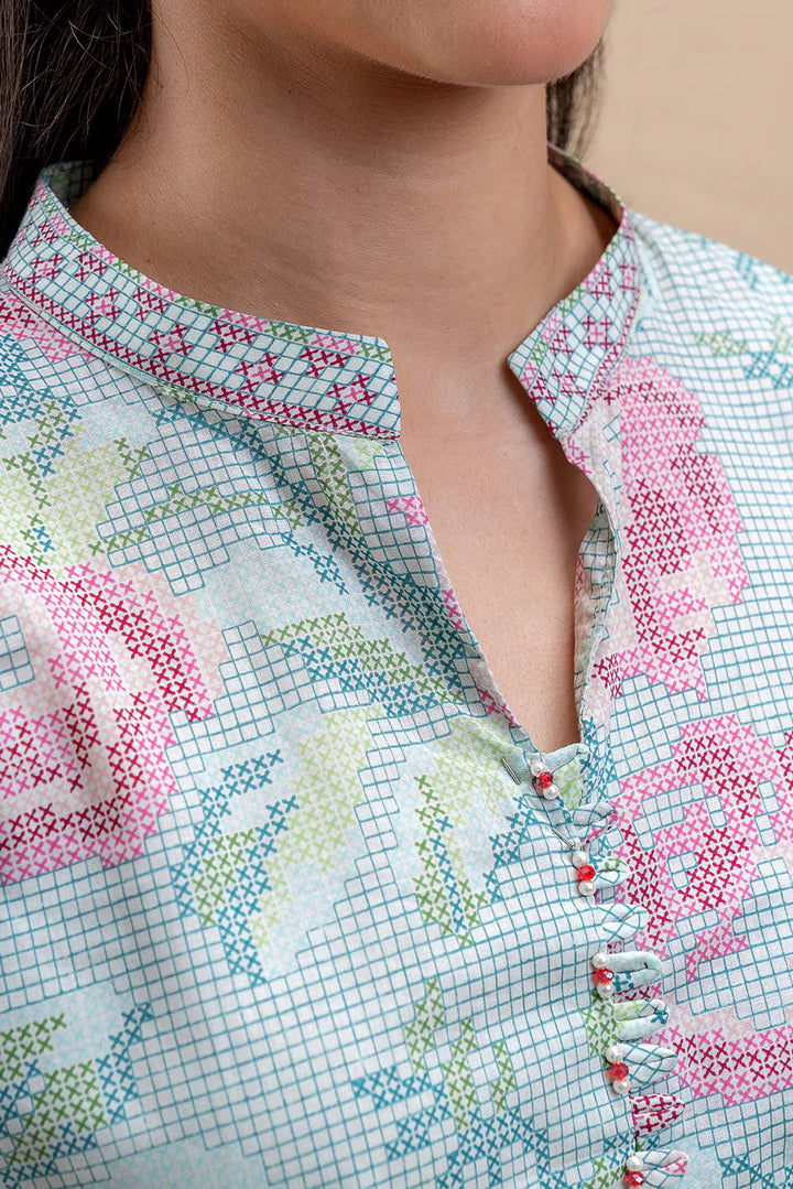 Printed sleeve from Pastel Blush—pleated cuff with green-white embroidery, pastel roses over grid-textured lawn.