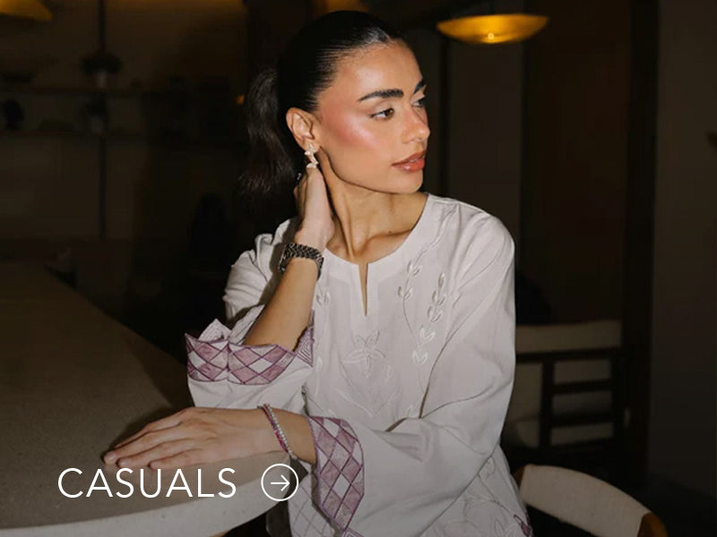 Model in a light blue casual kurta with floral and geometric prints; “Casuals” text below on Nainpreet’s banner..