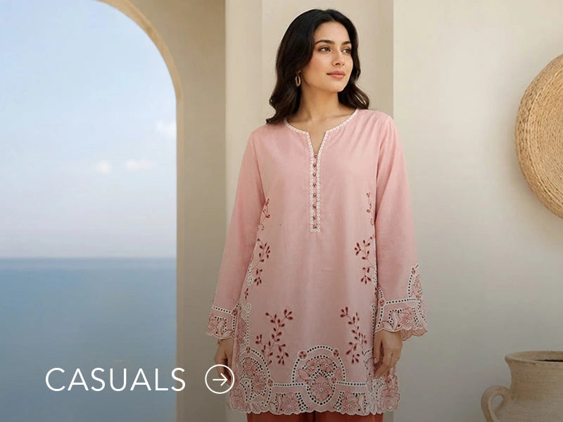 Model in a light blue casual kurta with floral and geometric prints; “Casuals” text below on Nainpreet’s banner..