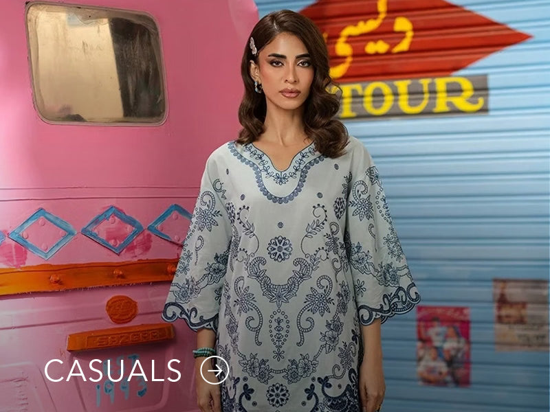 Model in a light blue casual kurta with floral and geometric prints; “Casuals” text below on Nainpreet’s banner..