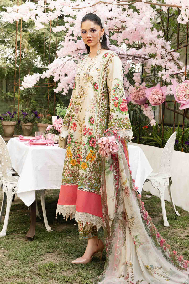Side profile of the model in MPT-2605-A — cream florals with pink lace trim, chiffon dupatta trailing softly beside cherry blossoms