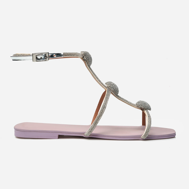 Detail view of Eliana pink crystal flats from Nainpreet’s Soleil Eid Al Adha ’25 drop, featuring lilac sole, floating heart embellishments, and shimmer-strapped elegance for celebratory styling.