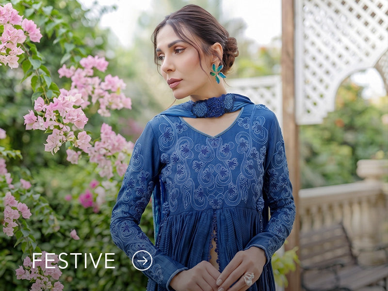 A banner for the festive collection on Nainpreet, featuring embroidered velvet and celebratory accents.