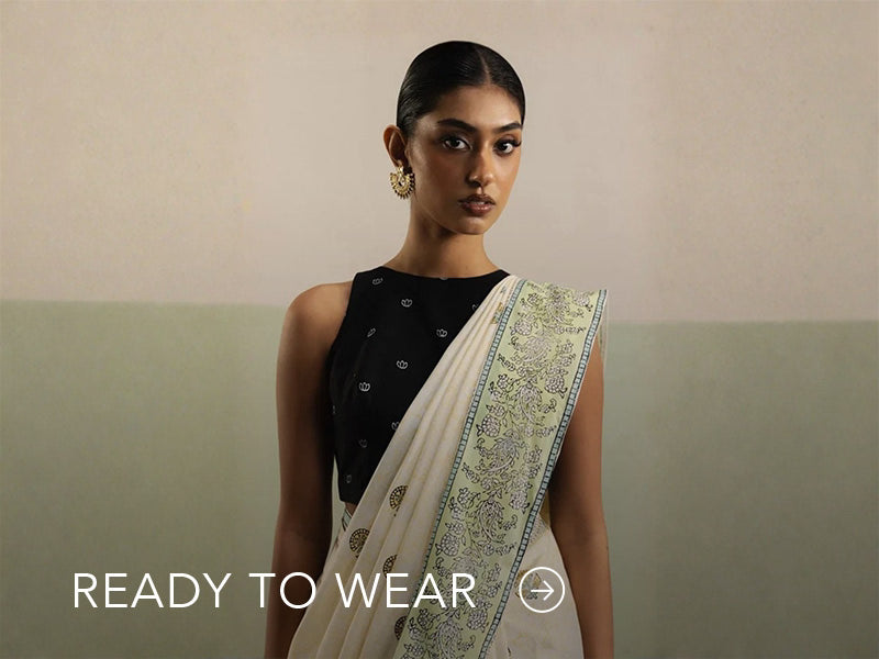 Green embroidered outfit styled in a warm indoor setting; Nainpreet’s “Ready to Wear” text sits below on the banner.