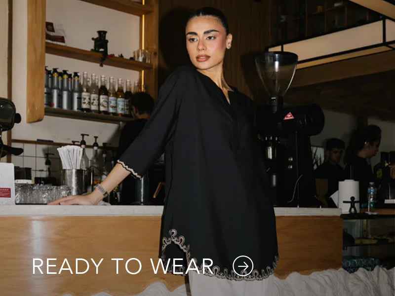 Green embroidered outfit styled in a warm indoor setting; Nainpreet’s “Ready to Wear” text sits below on the banner.