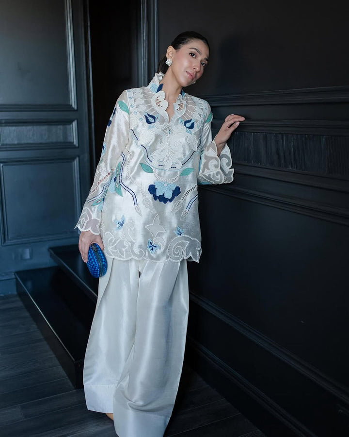 Model in Nadia Farooqui Azure white and blue embroidered short top from Deena Eid Edit '25 collection